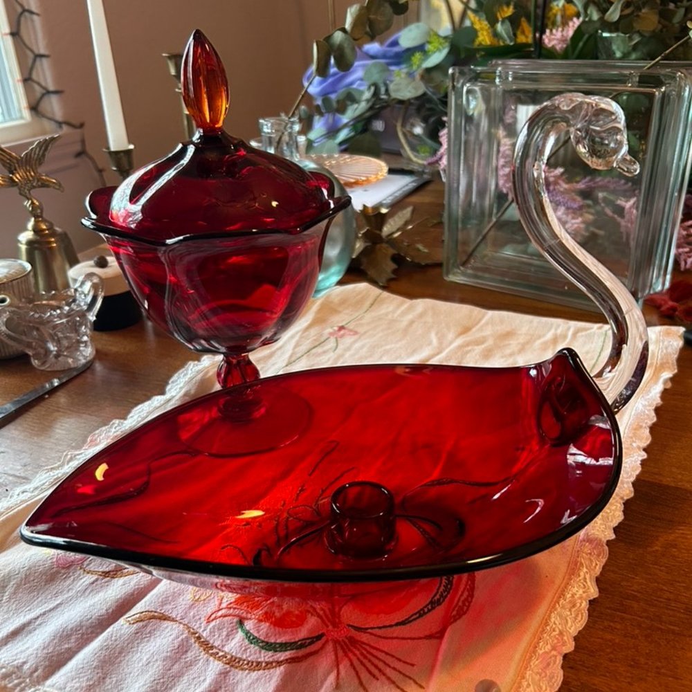 Ruby glass apothecary jar and swan candle stick holder
